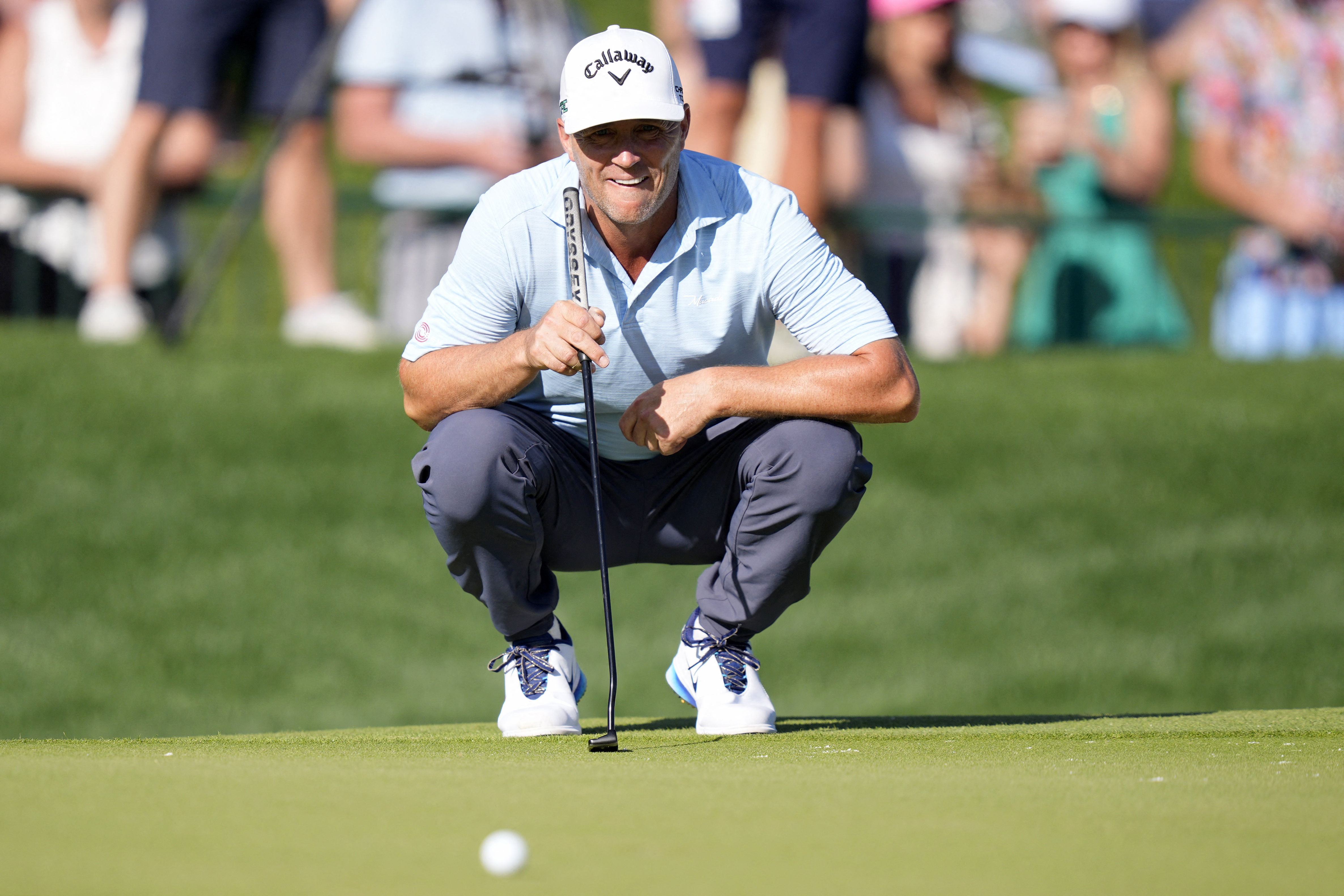 Alex Noren lining up a putt on the 18th green.