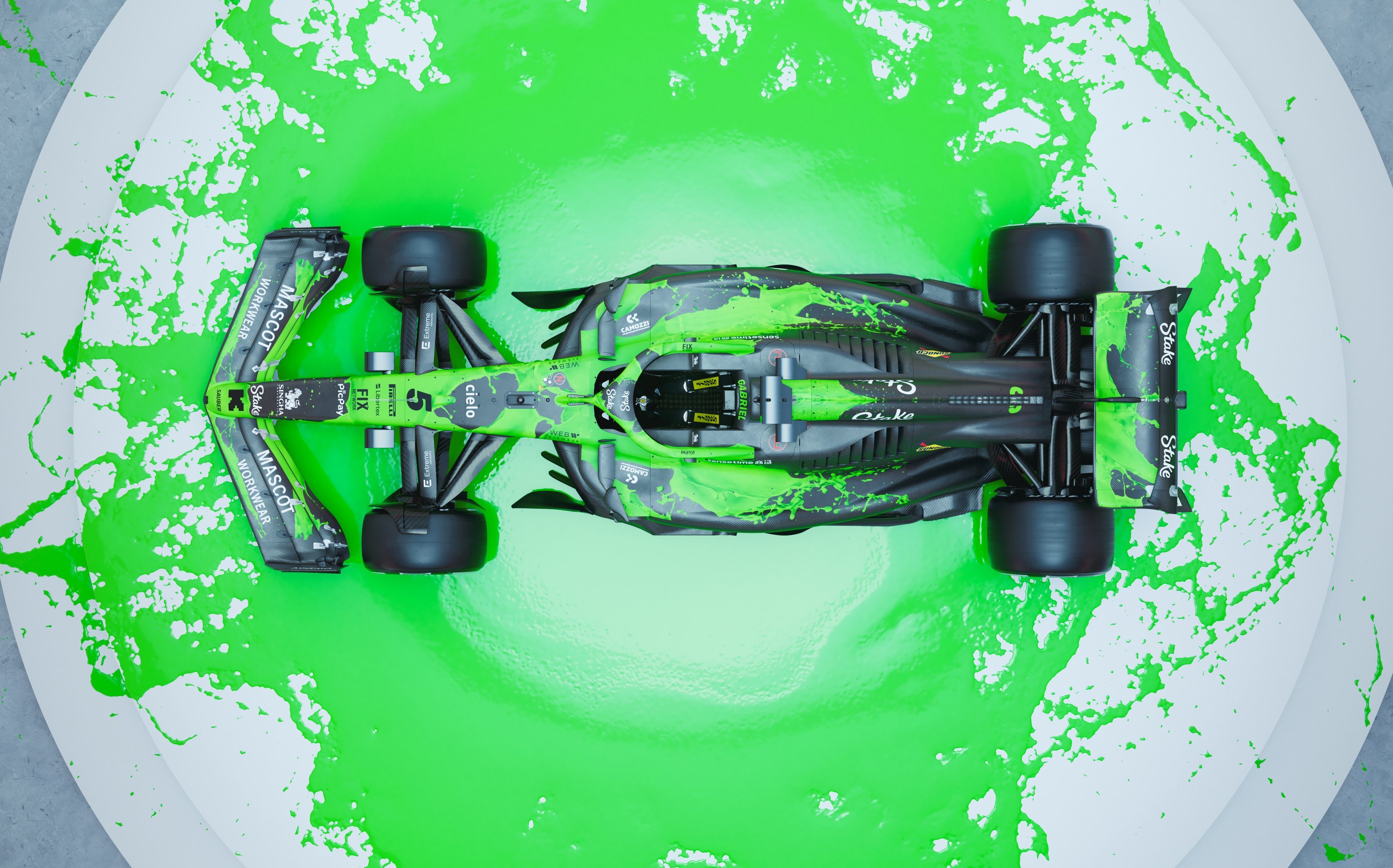 Formula 1 car in green paint splash.