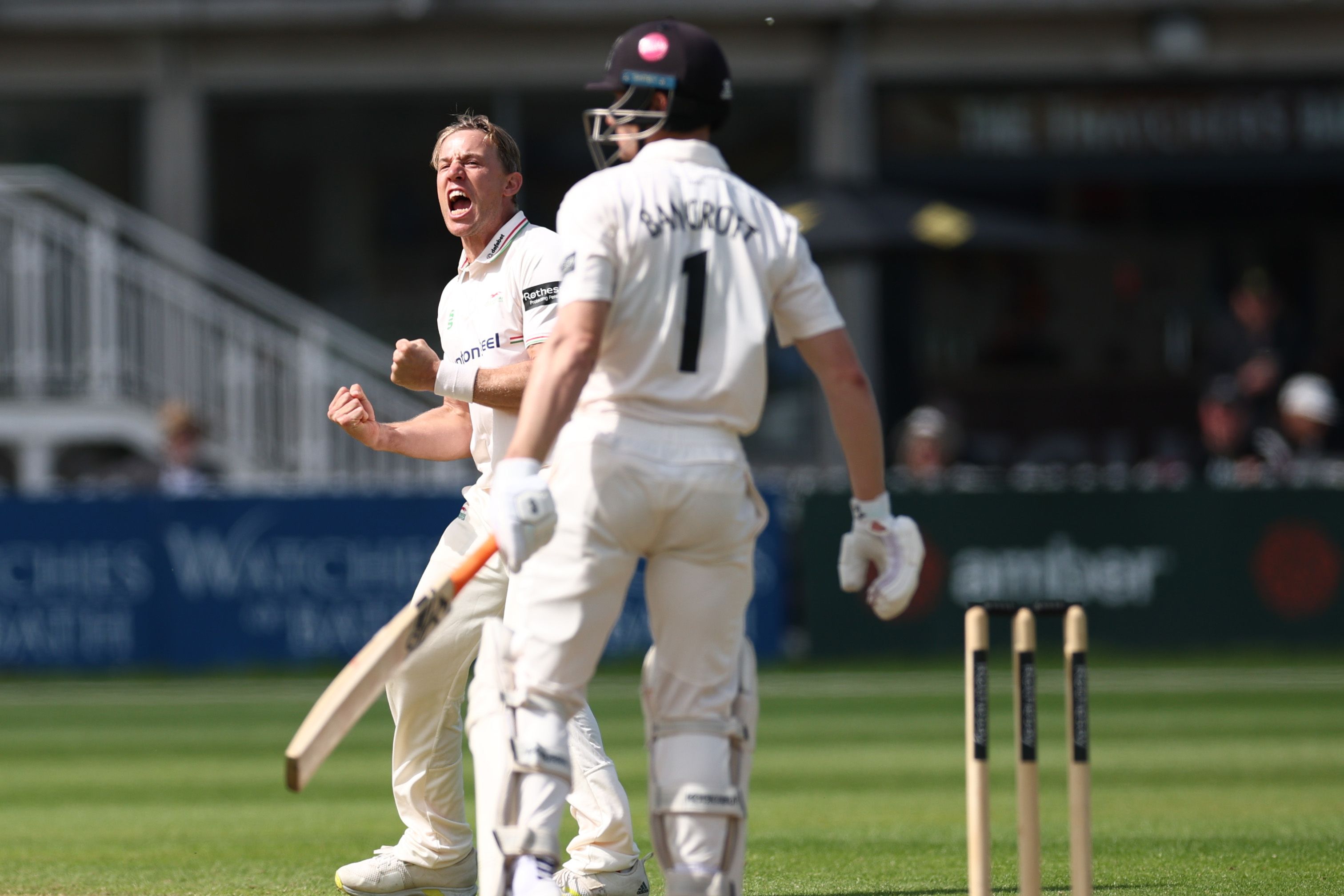 Cricket player celebrating a wicket.