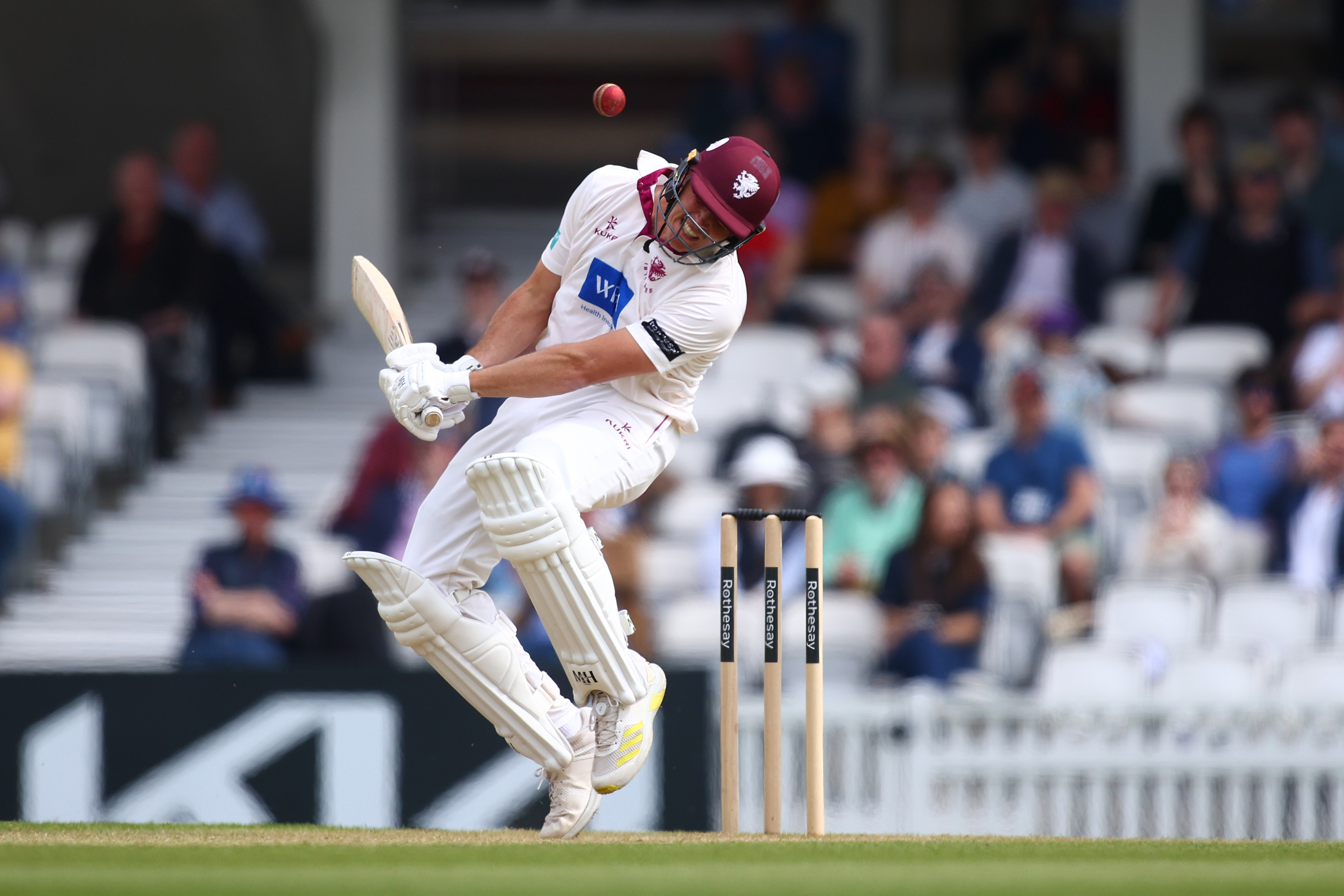 A cricket player batting during a match.