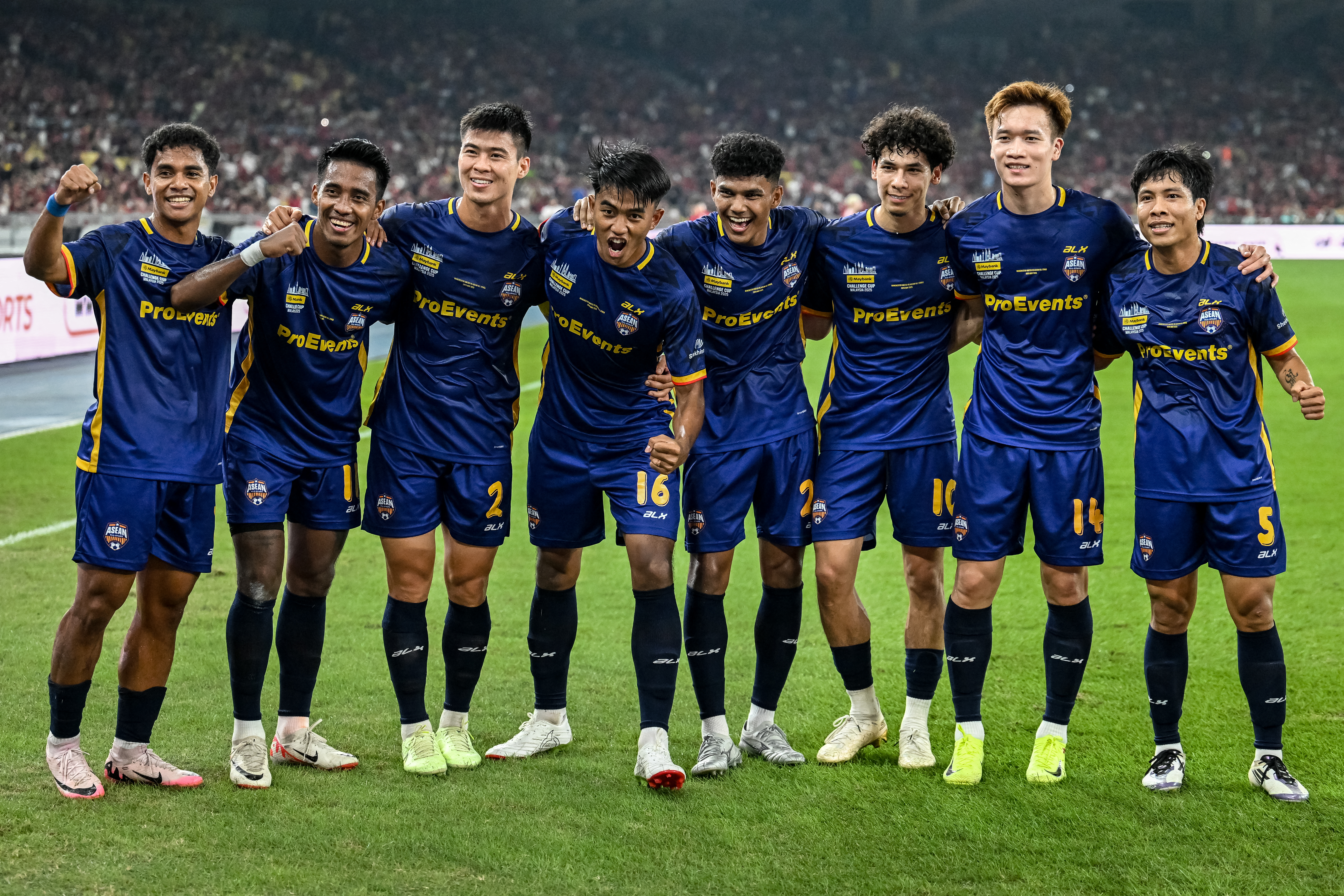 ASEAN All-Stars soccer players celebrating a goal.