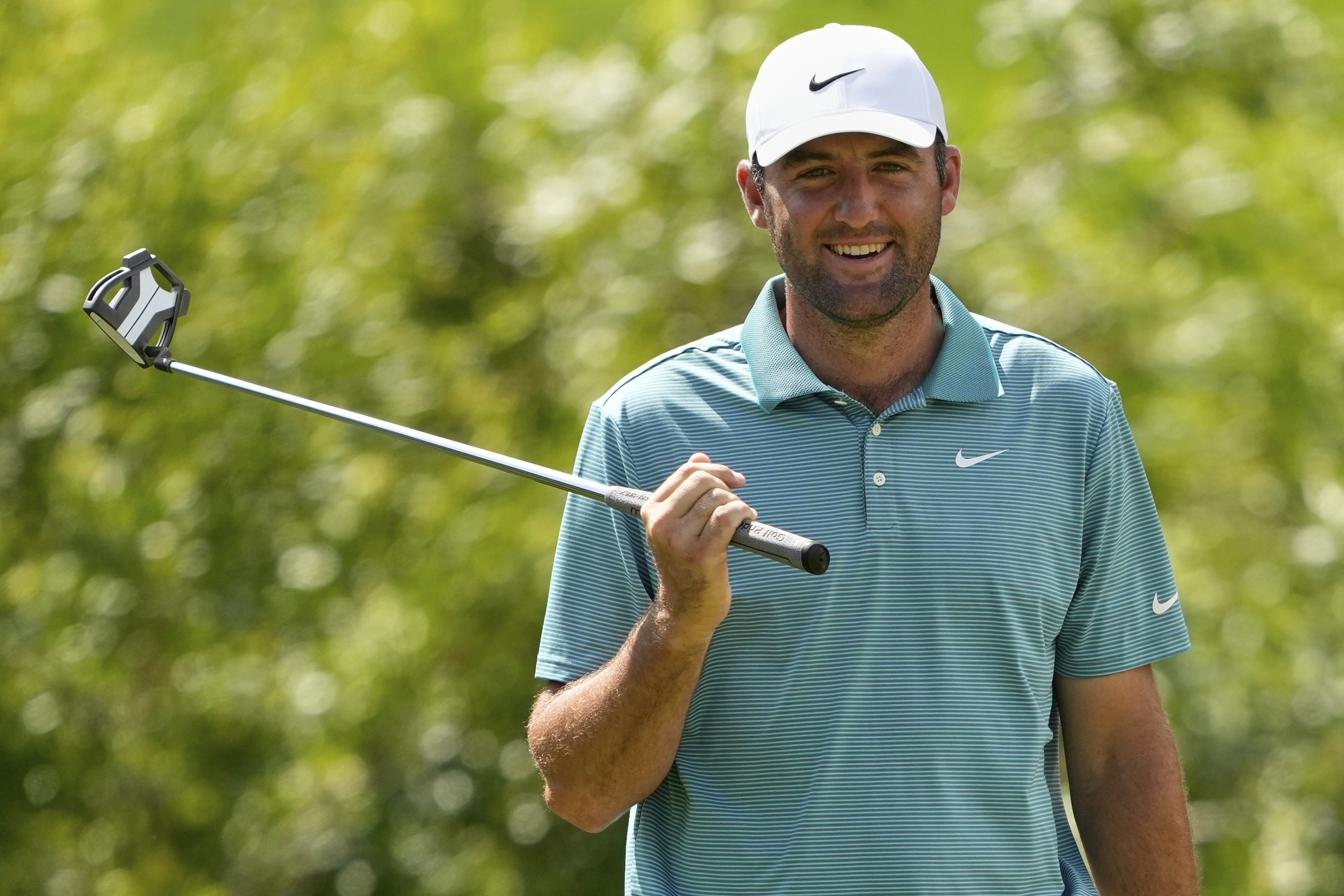 Scottie Scheffler smiling at the PGA Championship.